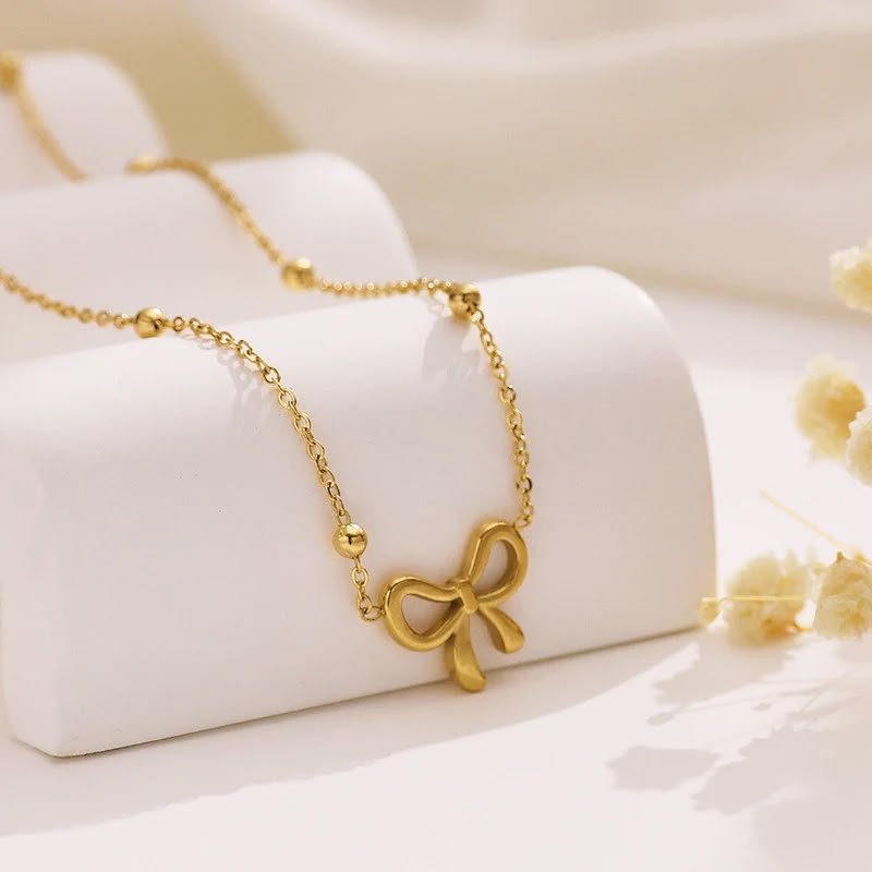 Golden Infinity Bow Pendant Necklace