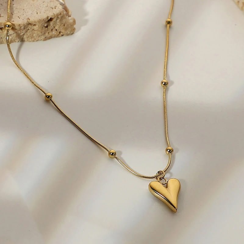 Golden Sculptural Open Heart Necklace
