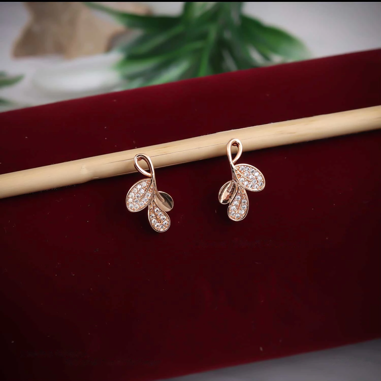Rose gold crystal leaf drop stud earrings