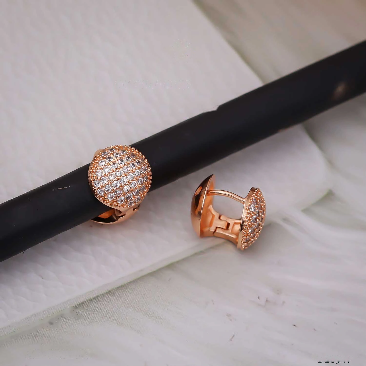 Rose gold domed pave crystal huggie hoop earrings