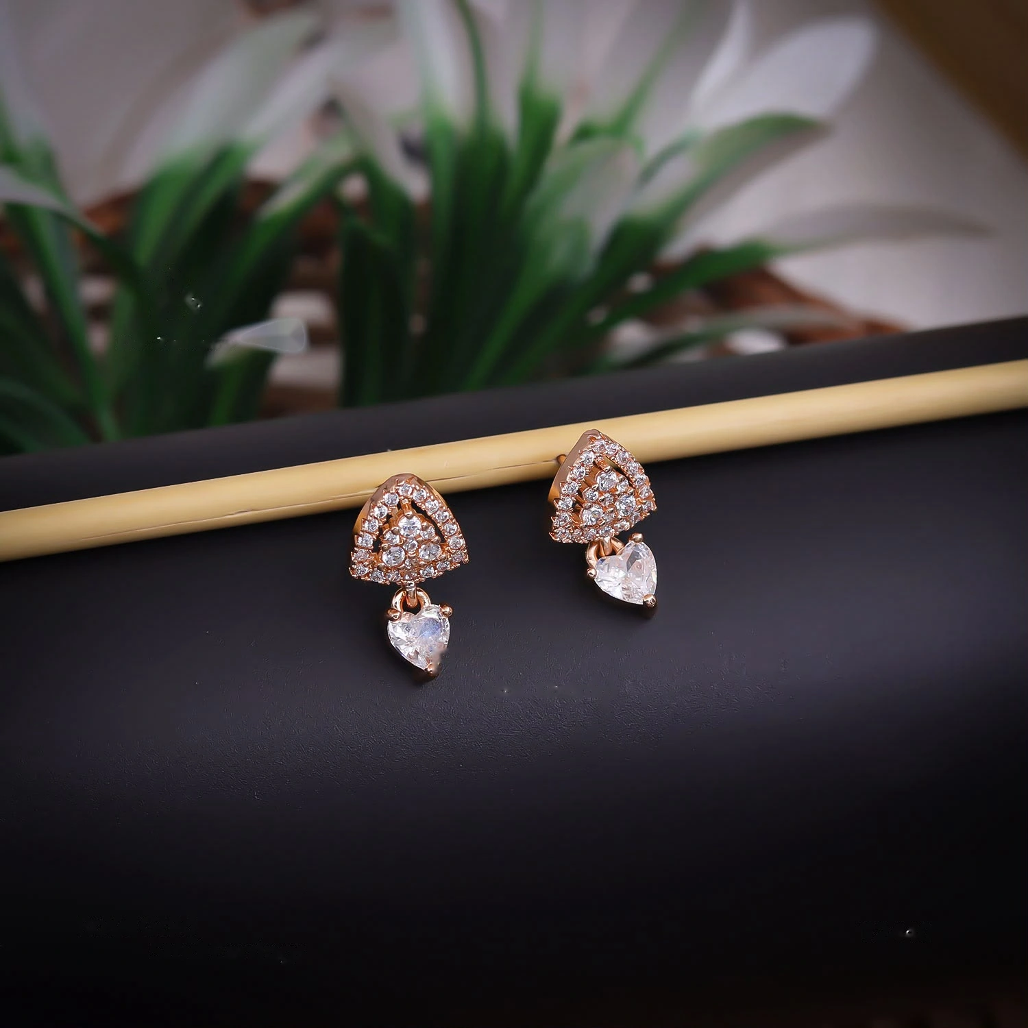 Rose gold triangle crystal stud earrings with heart drops